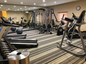 A gym with cardio equipment, weight machines, and exercise balls. - Candlewood Suites Houma by IHG (Houma)
