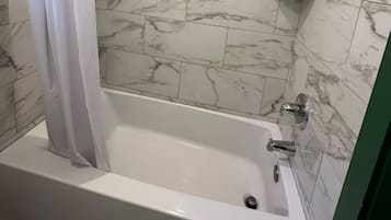 Standard Room, 1 King Bed | Bathroom | Combined shower/tub, hair dryer, towels