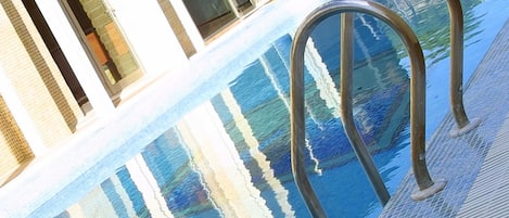 Seasonal outdoor pool, open 10:30 AM to 8:00 PM, sun loungers