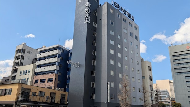 A multi-story hotel with a modern design, featuring a prominent 'DR' logo on the facade. - GR Hotel Ginzadori (Kumamoto)