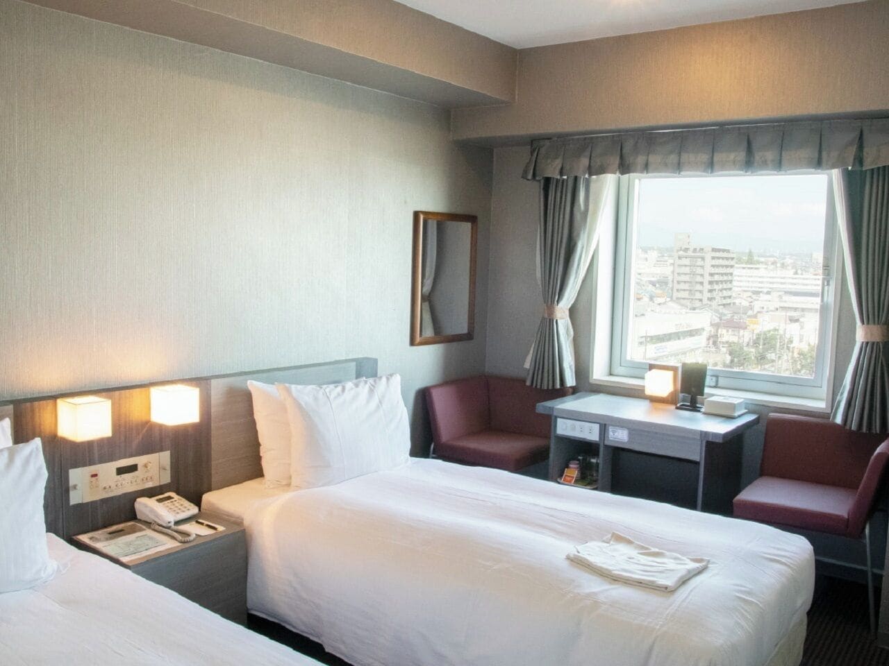 Economy Twin Room, Non Smoking | Down comforters, desk, blackout drapes, free WiFi