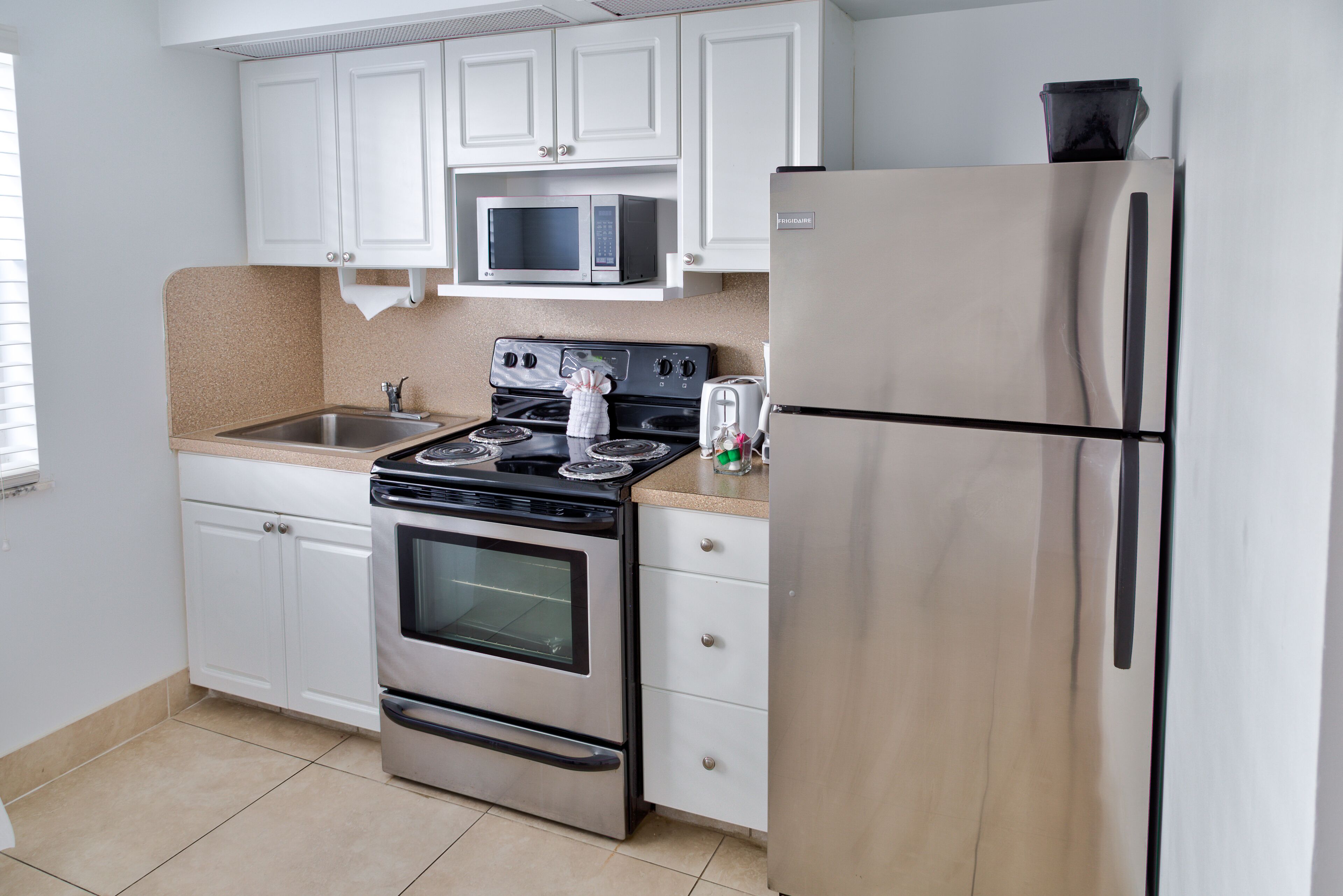 microwave, coffee/tea maker, toaster, freezer