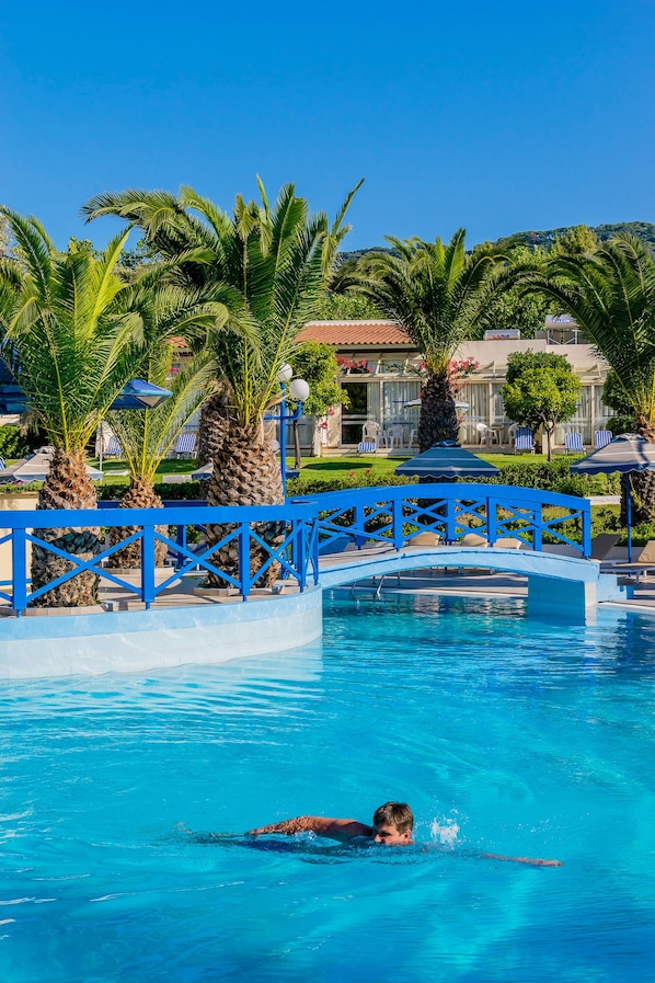 Seasonal outdoor pool, open 9:00 AM to 7:00 PM, pool umbrellas