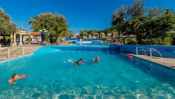 Seasonal outdoor pool, open 9:00 AM to 7:00 PM, pool umbrellas