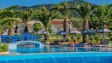 Seasonal outdoor pool, open 9:00 AM to 7:00 PM, pool umbrellas