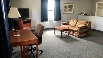 Economy Studio Suite, 1 King Bed | Living area | 32-inch TV with cable channels