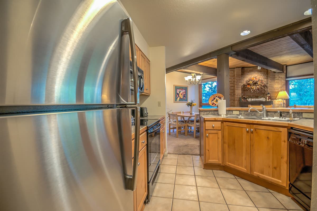 Condo, 2 Bedrooms | Private kitchen | Full-sized fridge, microwave, stovetop, coffee/tea maker