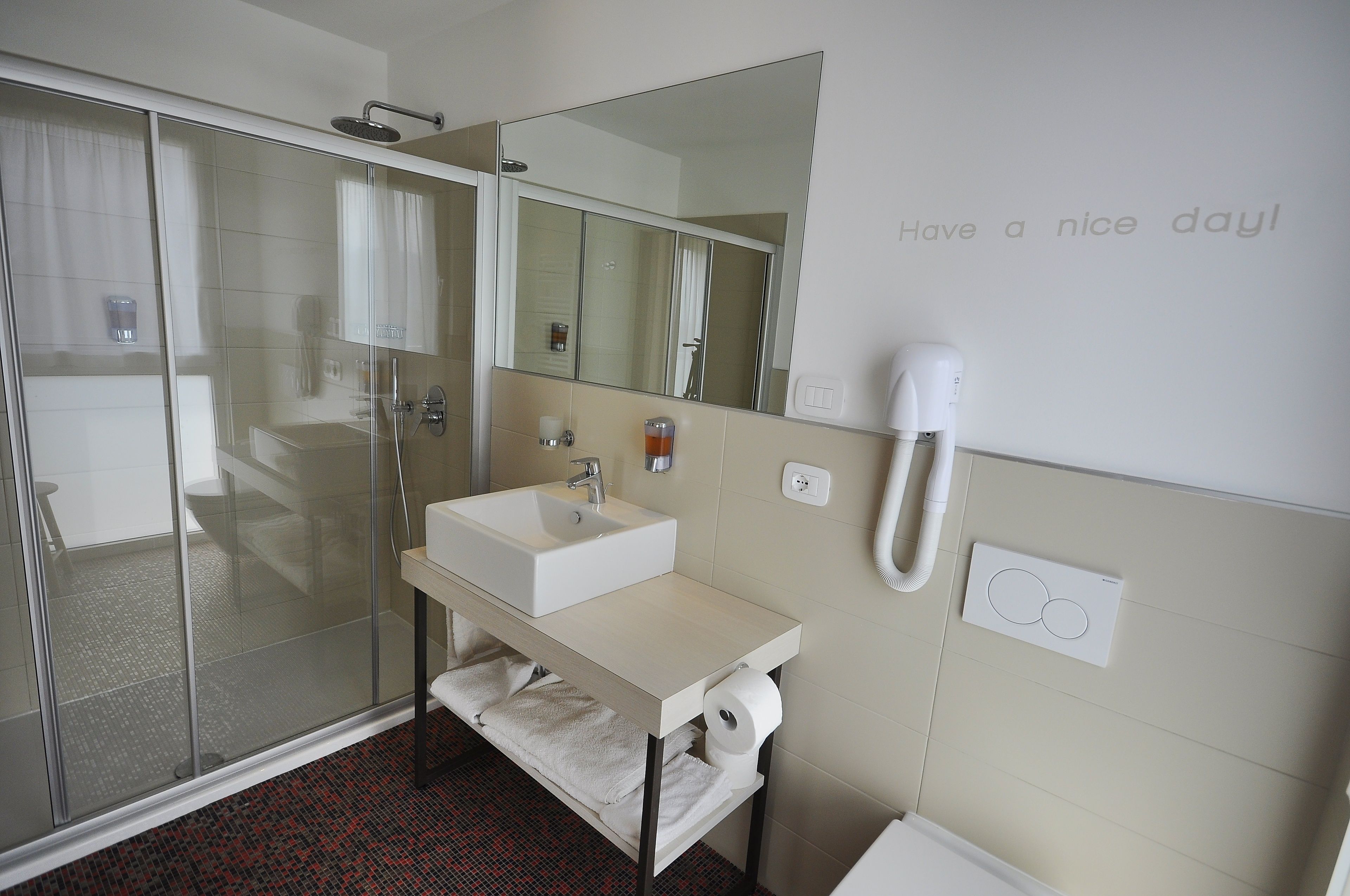 junior suite | bathroom | shower, hair dryer, bidet, towels
