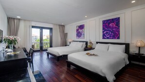 A hotel room with two beds, a desk, and a balcony. - Thanh Binh Riverside Hotel (Da Nang)