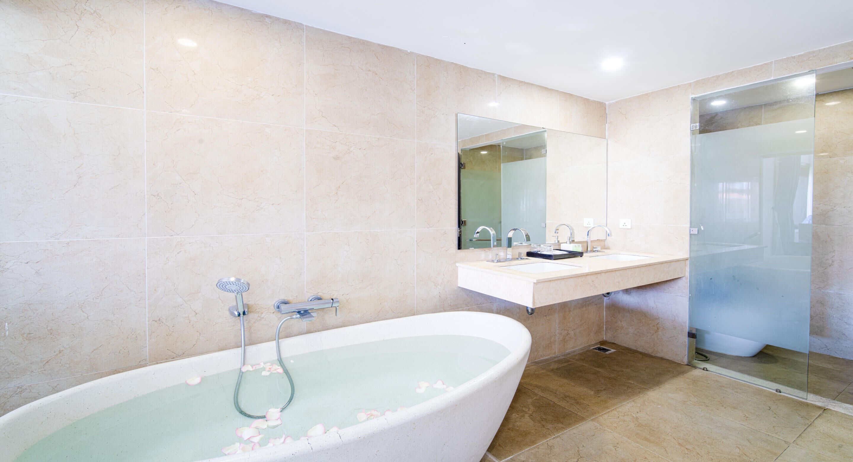 king room, pool view and river view with balcony and bathtub | bathroom | combined shower/bathtub, free toiletries, hair dryer, bathrobes