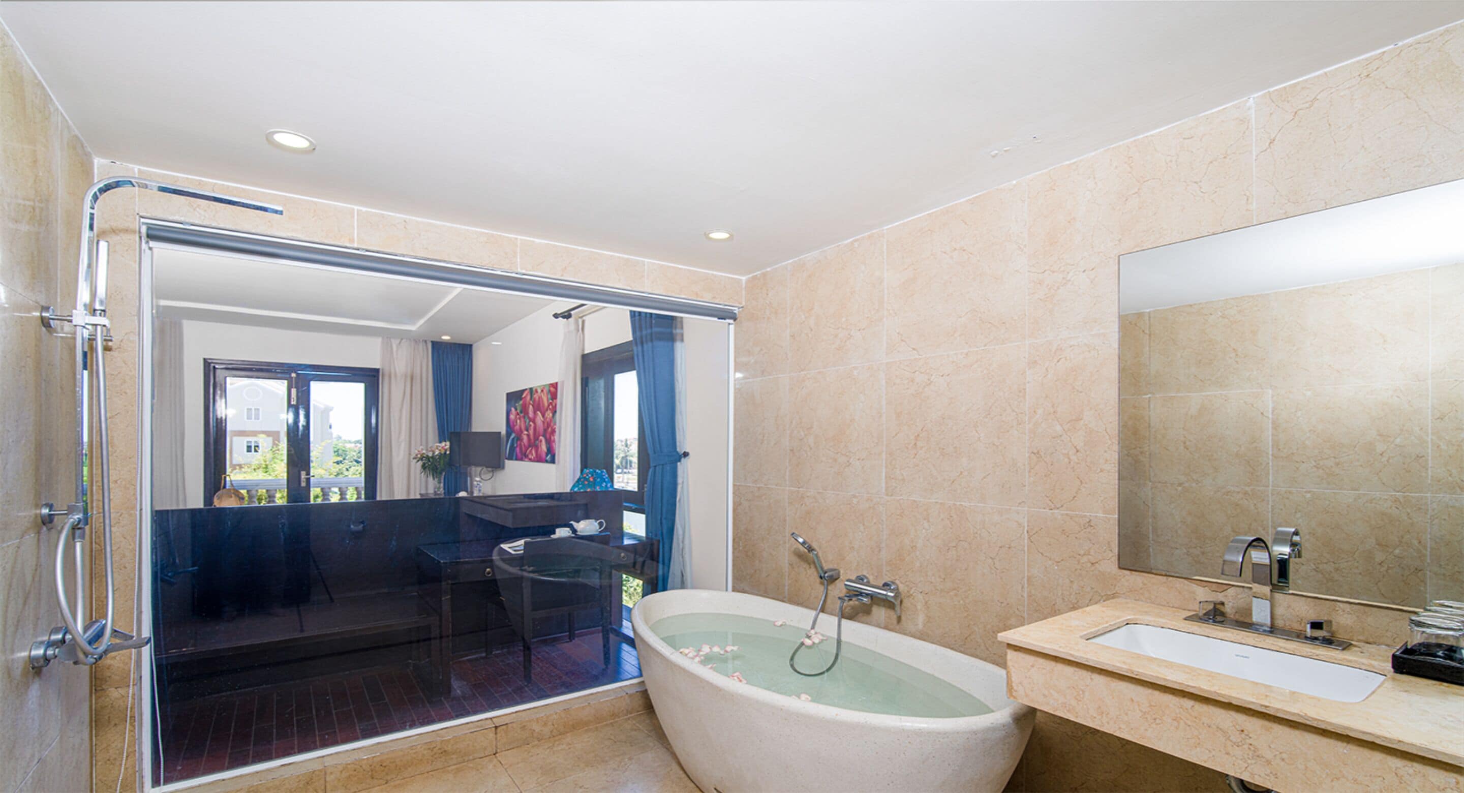 king room, pool view and river view with balcony and bathtub | deep-soaking bathtub