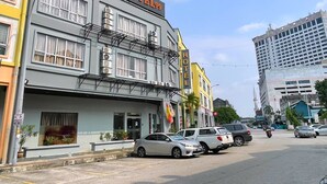 A multi-story building with a sign reading "HOTEL99".