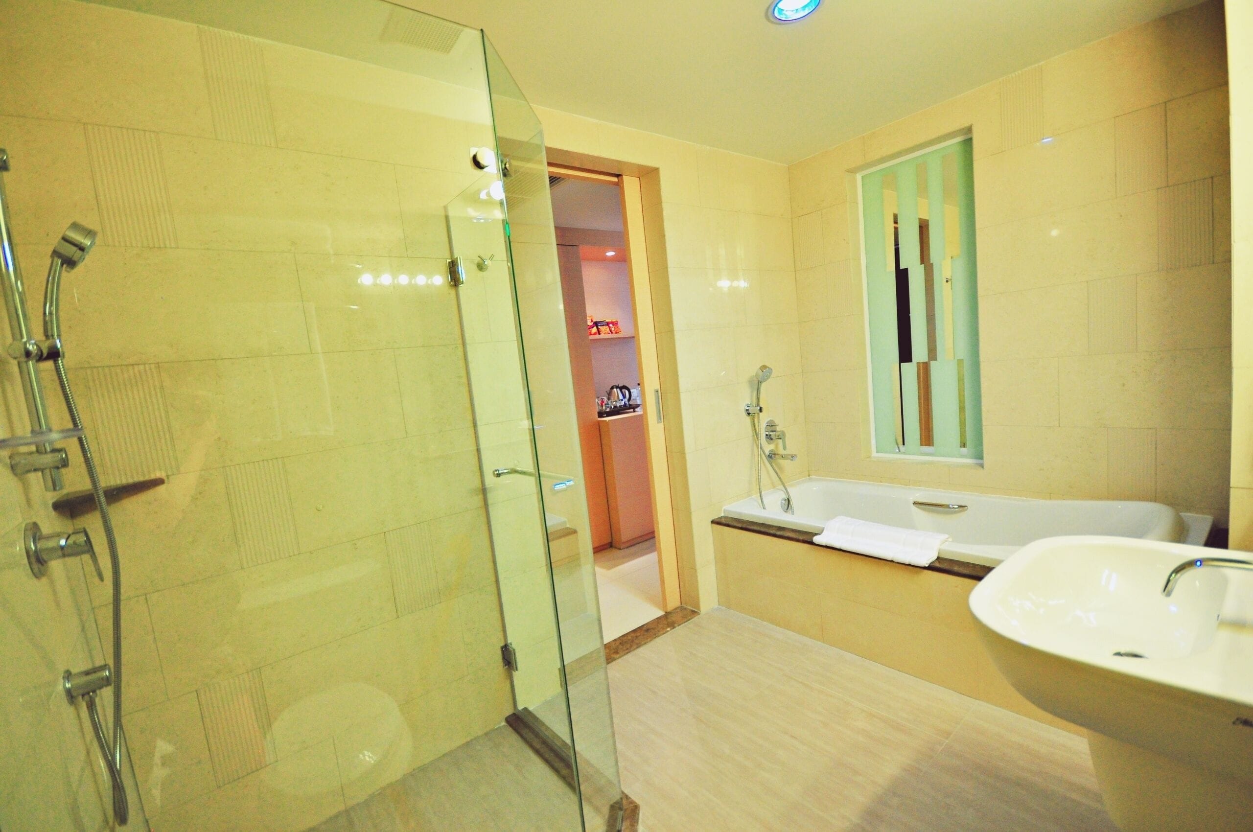 deluxe room | bathroom | separate bathtub and shower, deep-soaking bathtub, hair dryer, slippers
