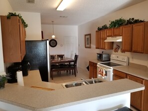 Luxury 5 Bedroom Home with Private Pool | Private kitchen | Fridge, microwave, oven, stovetop - American Homes Rental (Davenport)