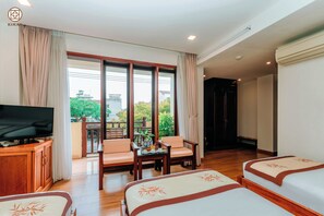 Triple Room | Minibar, in-room safe, desk, laptop workspace