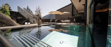 Indoor pool, outdoor pool, free pool cabanas, pool umbrellas