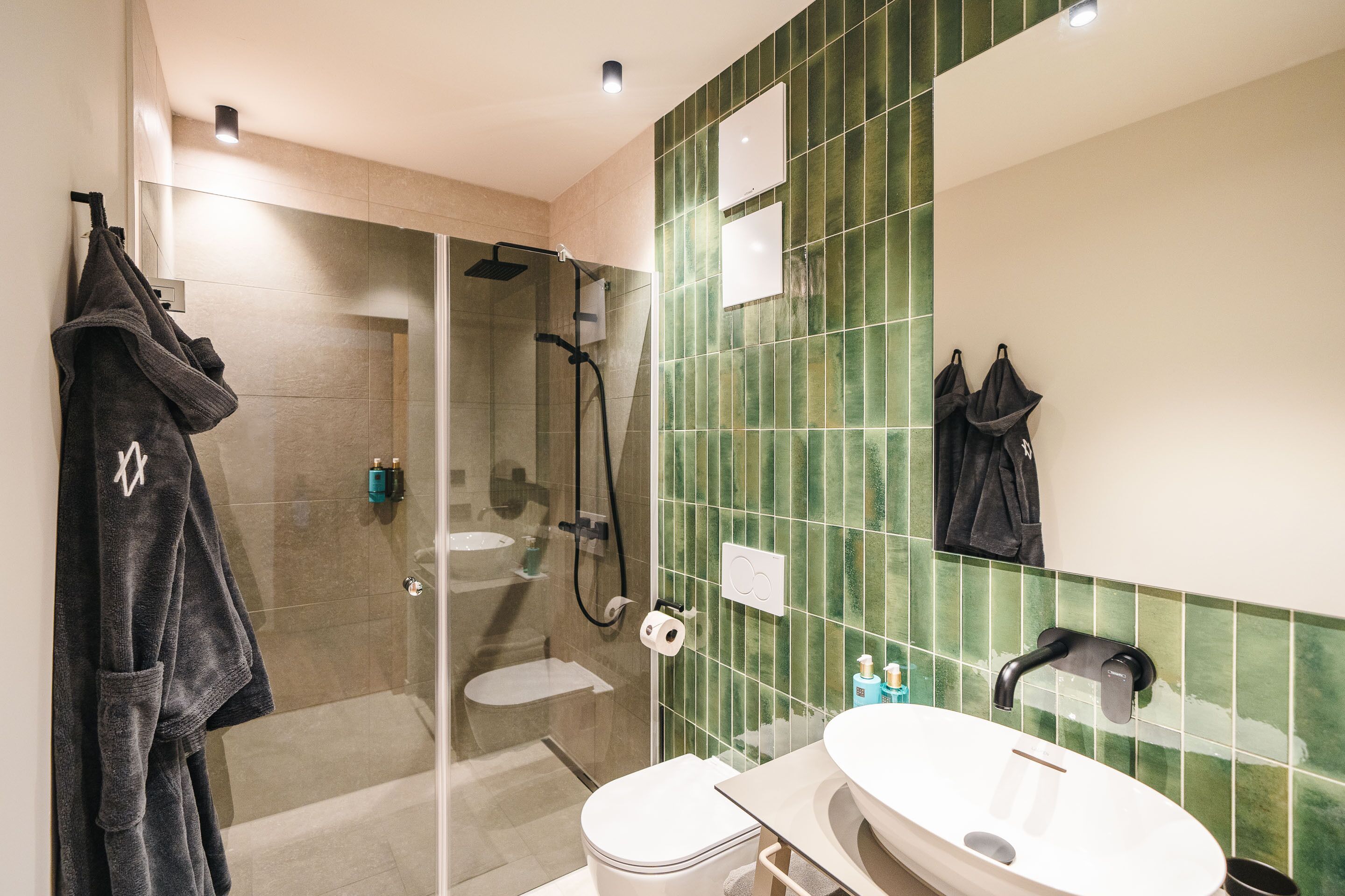 designer toiletries, hair dryer, bathrobes, slippers