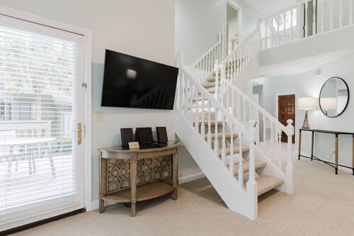 Deluxe Townhome | Living area | 38-inch flat-screen TV with cable channels, TV, DVD player