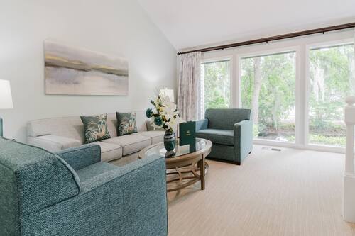 Deluxe Townhome | Living area | 38-inch flat-screen TV with cable channels, TV, DVD player