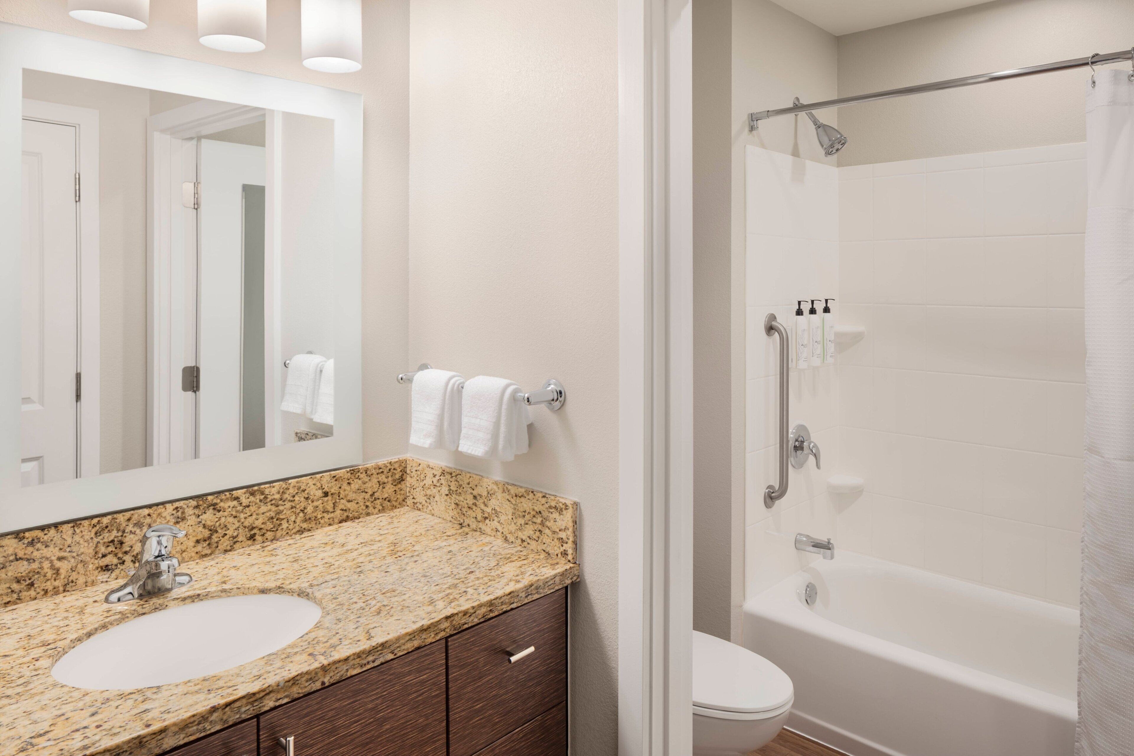 studio, 2 queen beds | bathroom | combined shower/bathtub, hair dryer, towels