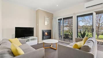 Family Suite | Living area | 50-inch flat-screen TV with digital channels, TV