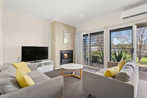Family Suite | Living area | 50-inch flat-screen TV with digital channels, TV