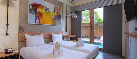 A hotel room with two beds, a painting, a pool view, and a TV.