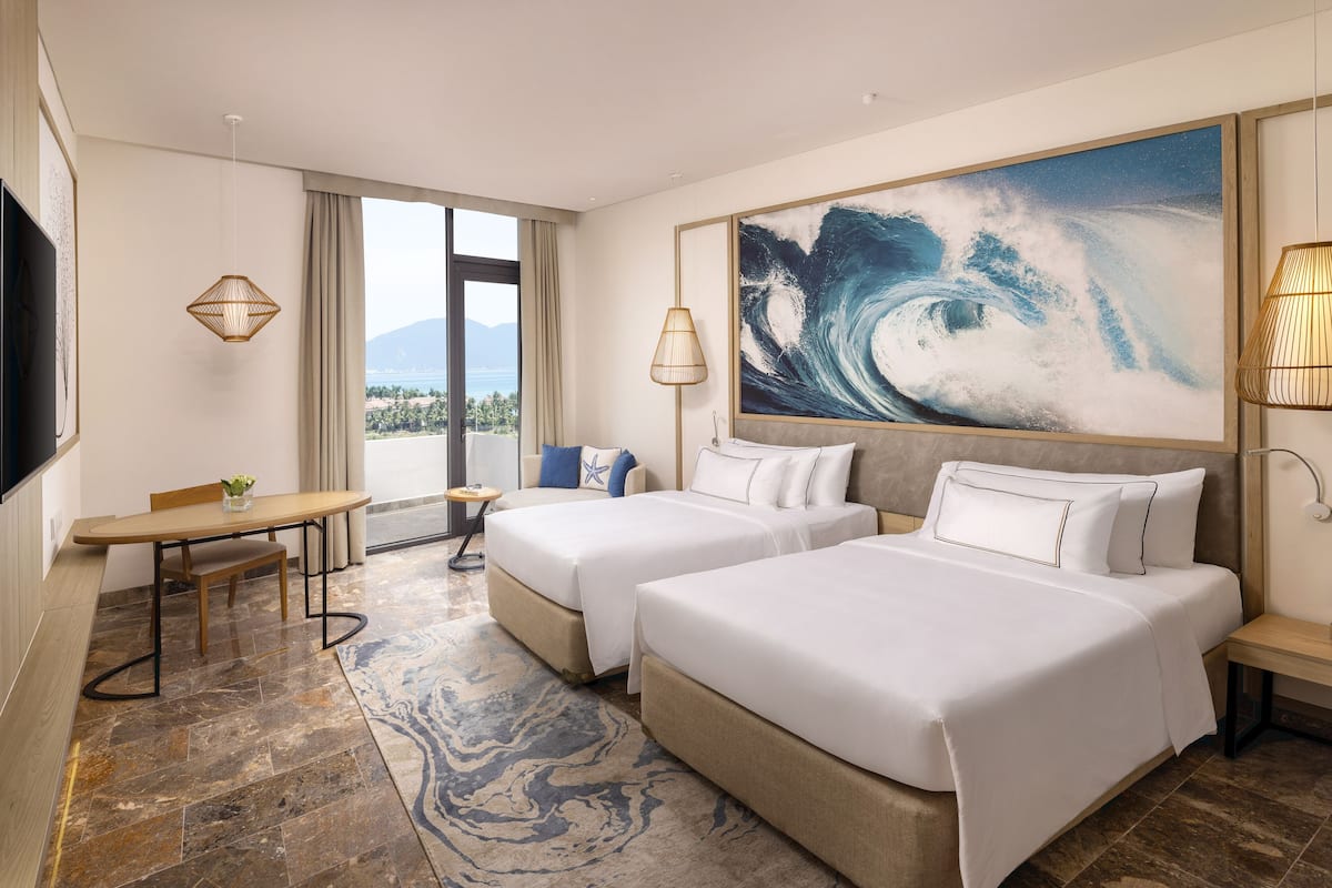 Premium Room, Partial Ocean View | 2 bedrooms, premium bedding, minibar, in-room safe