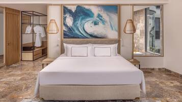 A modern bedroom with a large bed, a wardrobe, a mirror, and a painting of a wave.