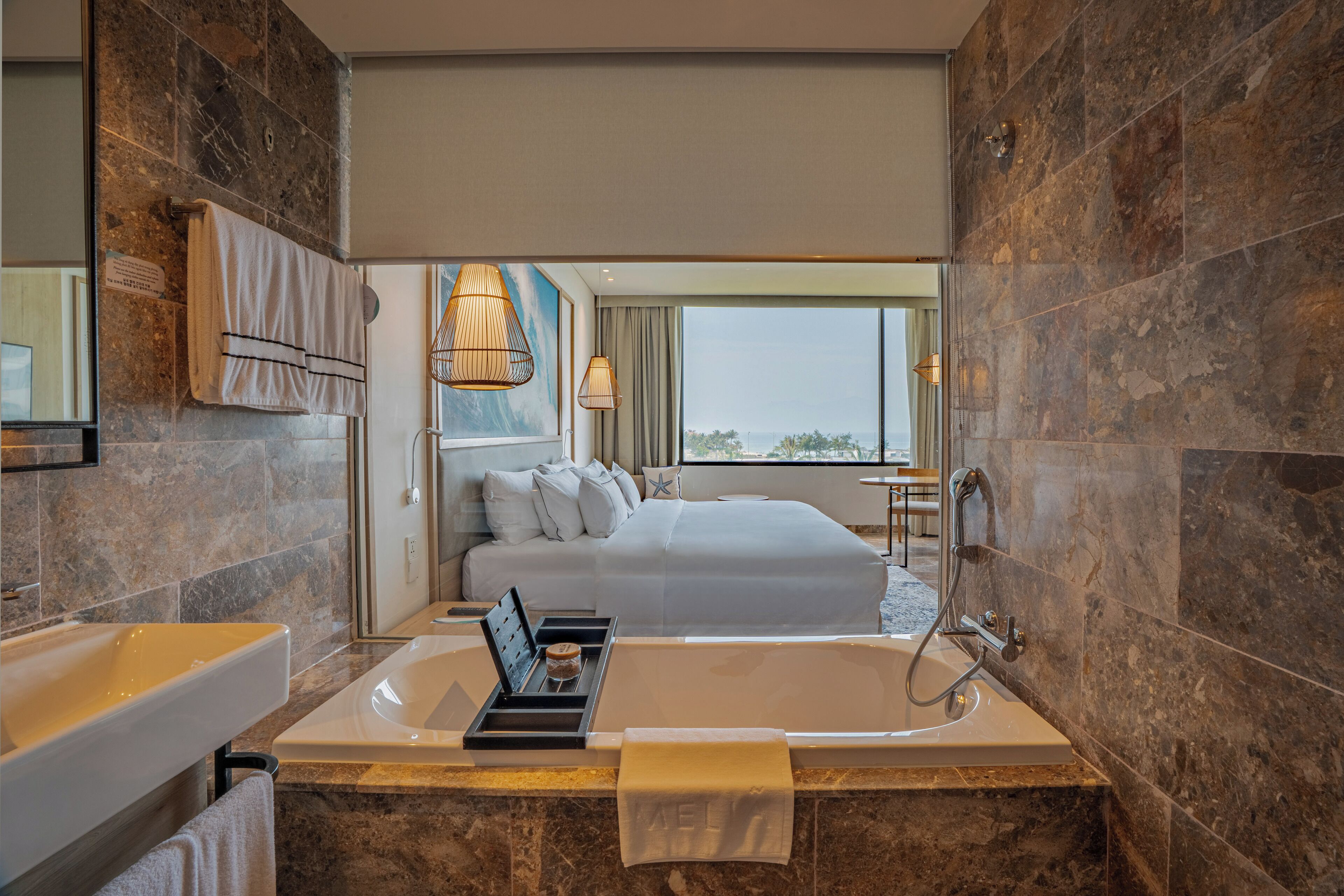 deluxe room, ocean view | bathroom | eco-friendly toiletries, hair dryer, bathrobes, slippers