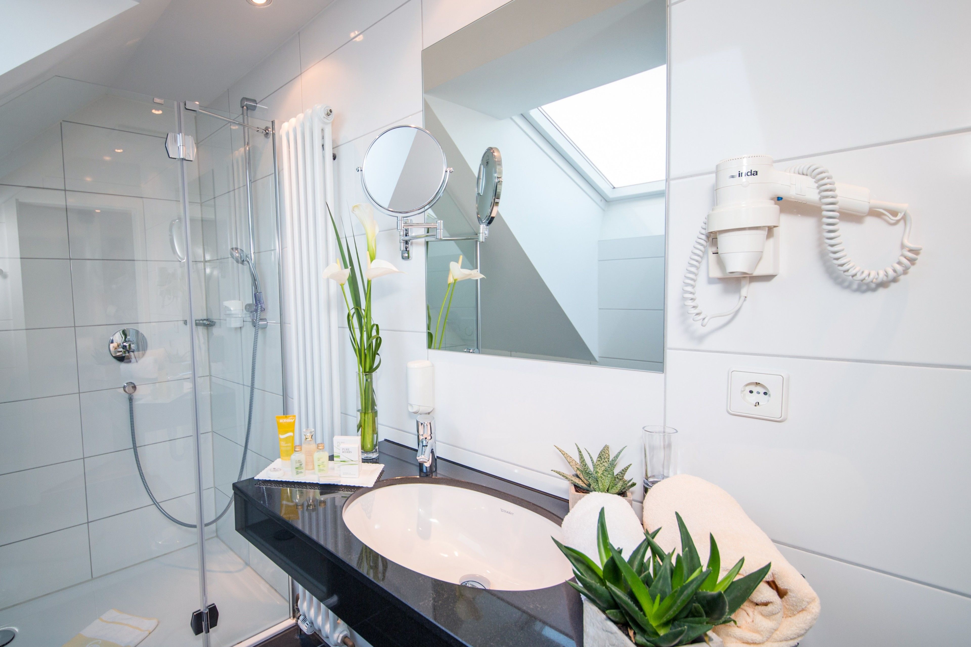 eco-friendly toiletries, hair dryer, bathrobes, slippers