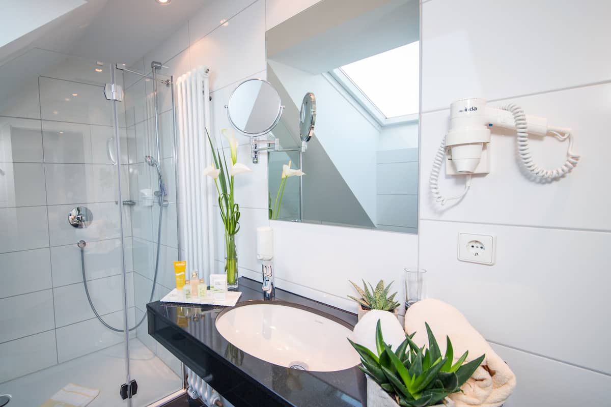 eco-friendly toiletries, hair dryer, bathrobes, slippers