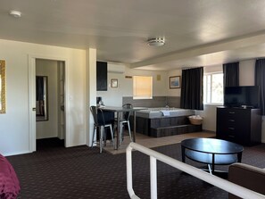 King Suite with Spa Bath- No Pets Allowed | Blackout drapes, iron/ironing board, free WiFi, bed sheets