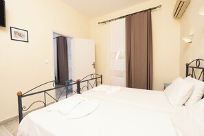 Standard Triple Room | Individually furnished, blackout curtains, iron/ironing board, free WiFi