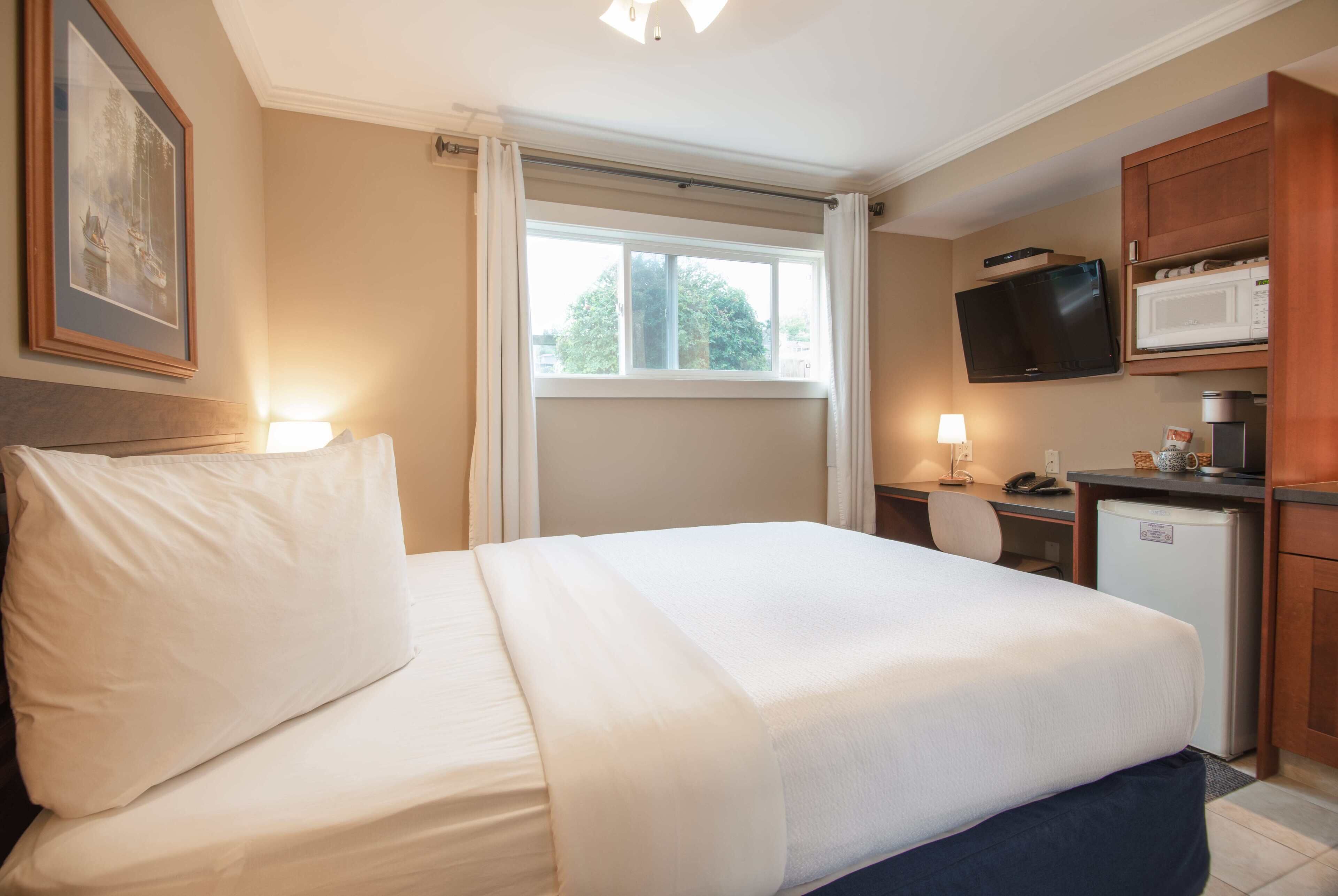 1 bedroom, premium bedding, laptop workspace, blackout curtains