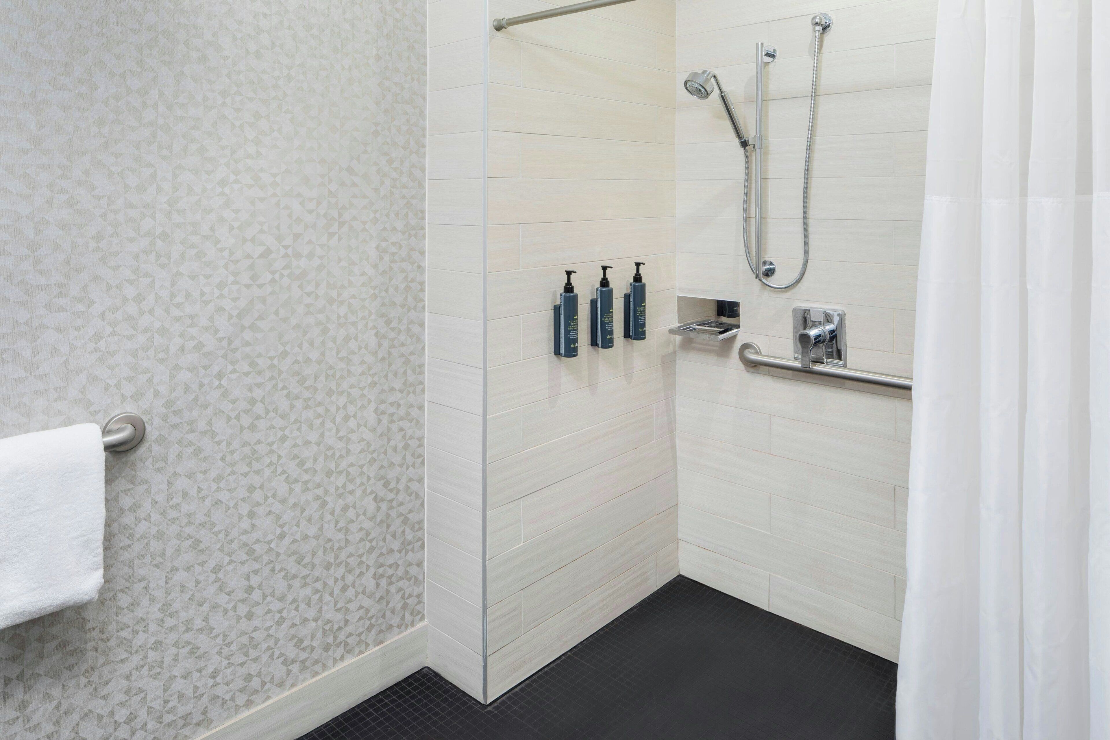 rainfall showerhead, designer toiletries, hair dryer, towels