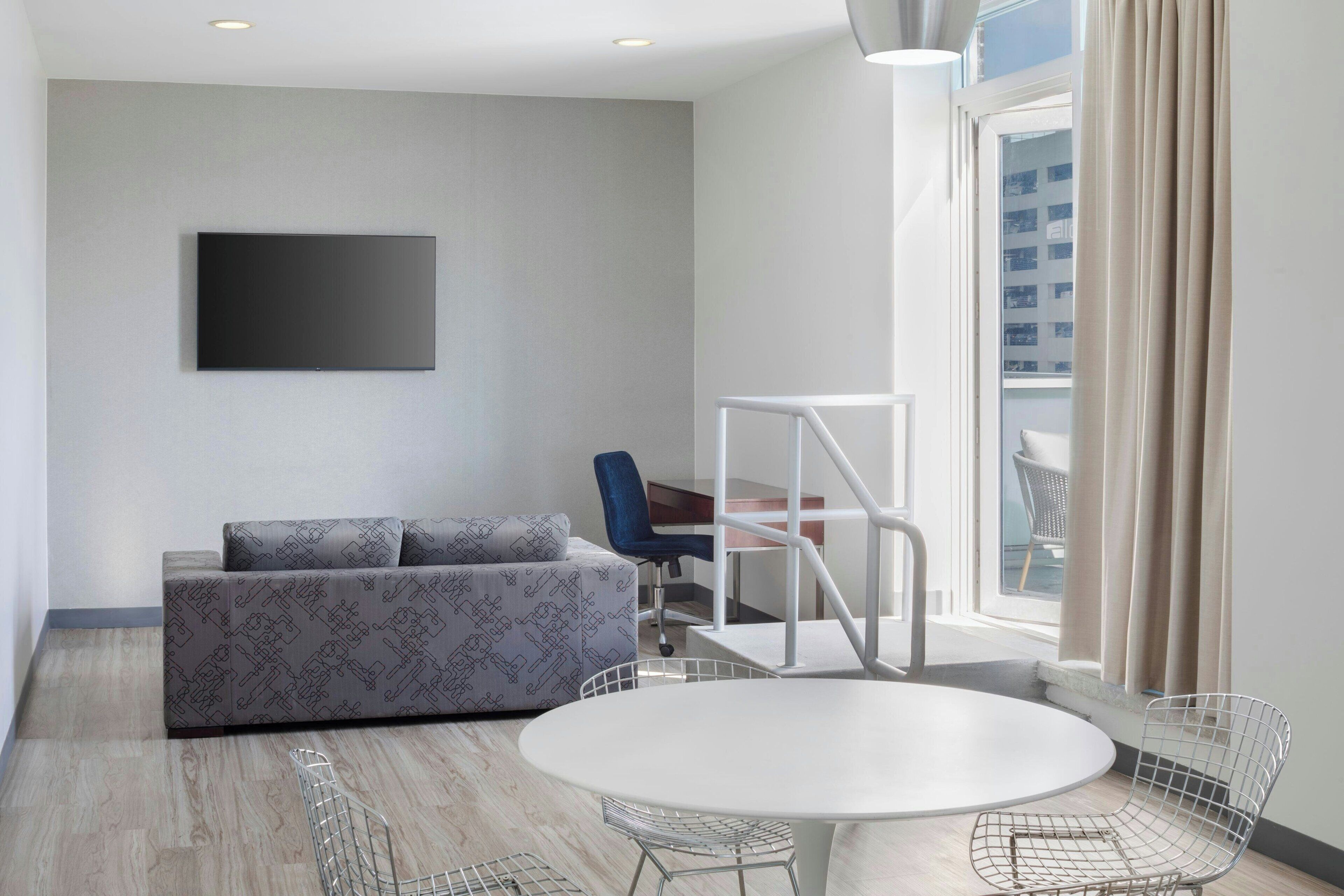 presidential suite, 1 king bed, river view | living room | lcd tv