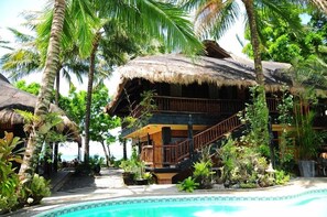 2 outdoor pools, a waterfall pool, pool umbrellas, pool loungers - Nabulao Beach and Dive Resort (Hinoba-an)
