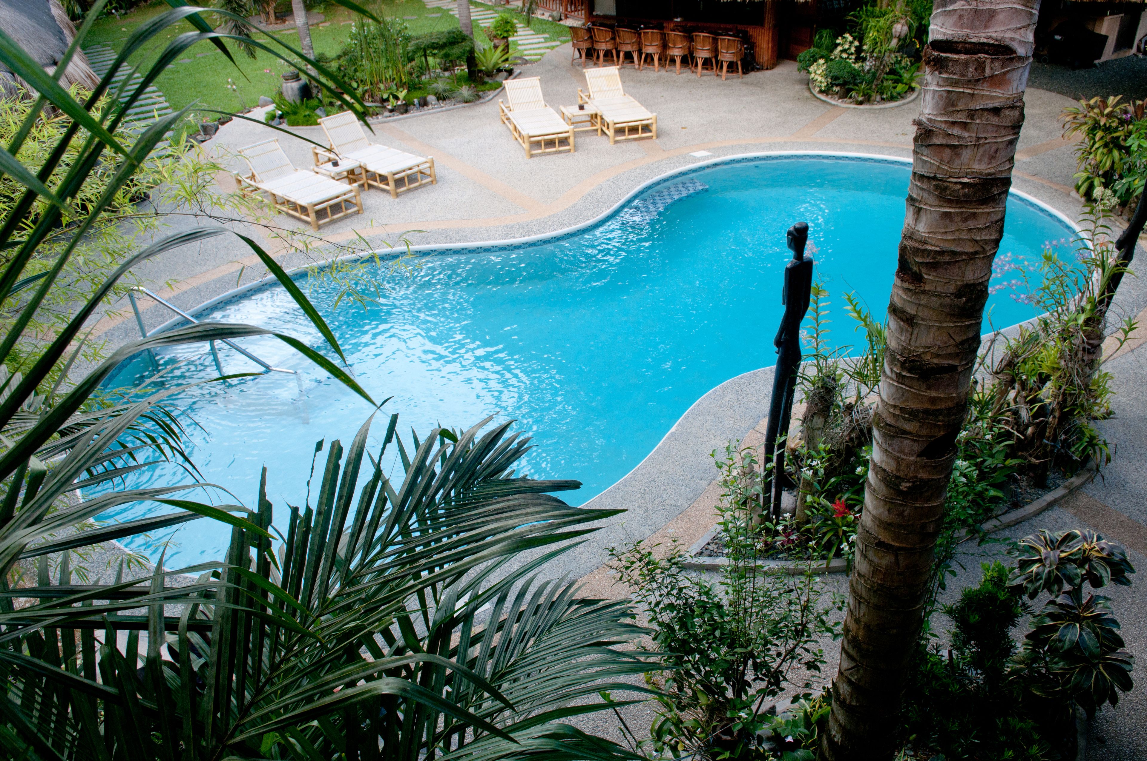 2 outdoor pools, a waterfall pool, pool umbrellas, sun loungers