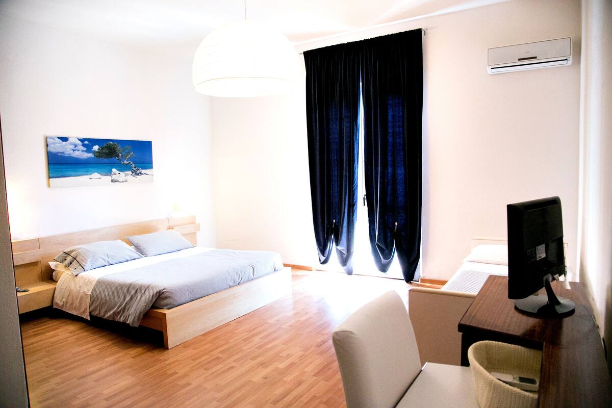 quadruple room, balcony | in-room safe, desk, blackout curtains, free wifi