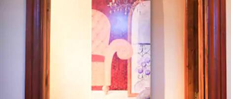 A framed abstract painting on a wall.