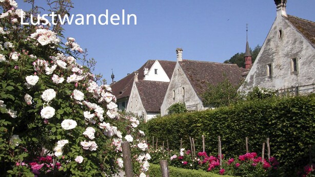 A traditional European building with a stone facade, surrounded by well-maintained gardens with blooming flowers. - Stiftung Kartause Ittingen (Warth-Weiningen)