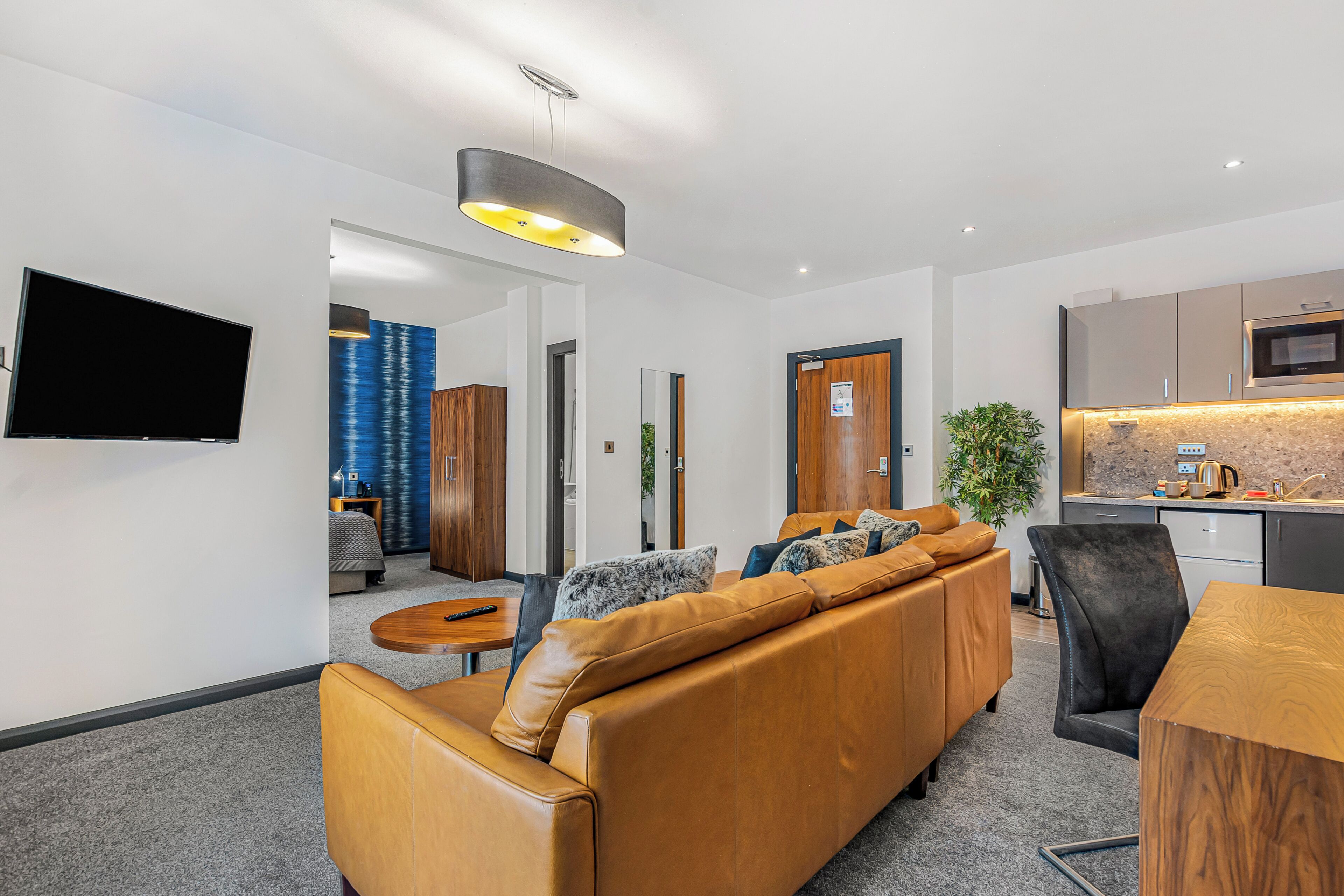 deluxe suite (double) | living area | 32-inch flat-screen tv with satellite channels, tv