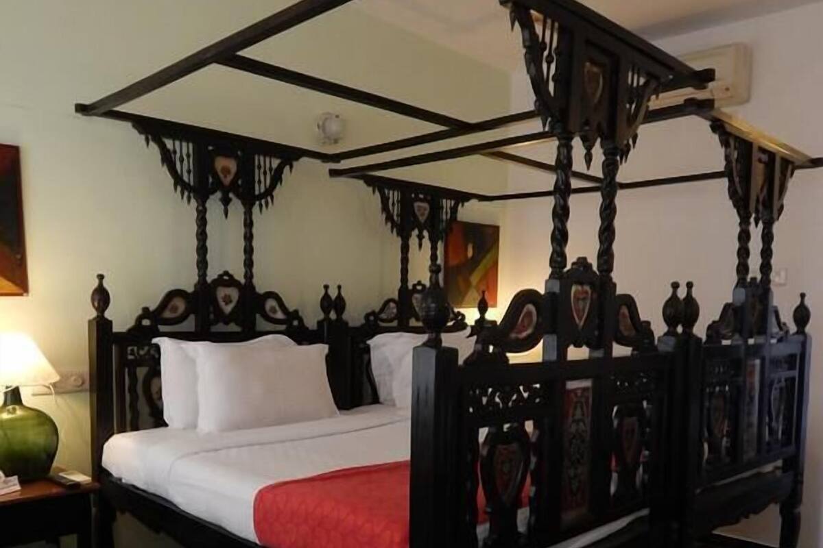 Quarto superior | Frigobar, cofres nos quartos, Wi-Fi de cortesia, roupa de cama