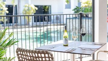 Enjoy a romantic dinner for two on the balcony overlooking the pool.