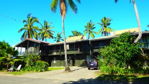 A two-story building with a flat roof and a balcony on the upper floor. - Bamboo Backpackers (Nadi)