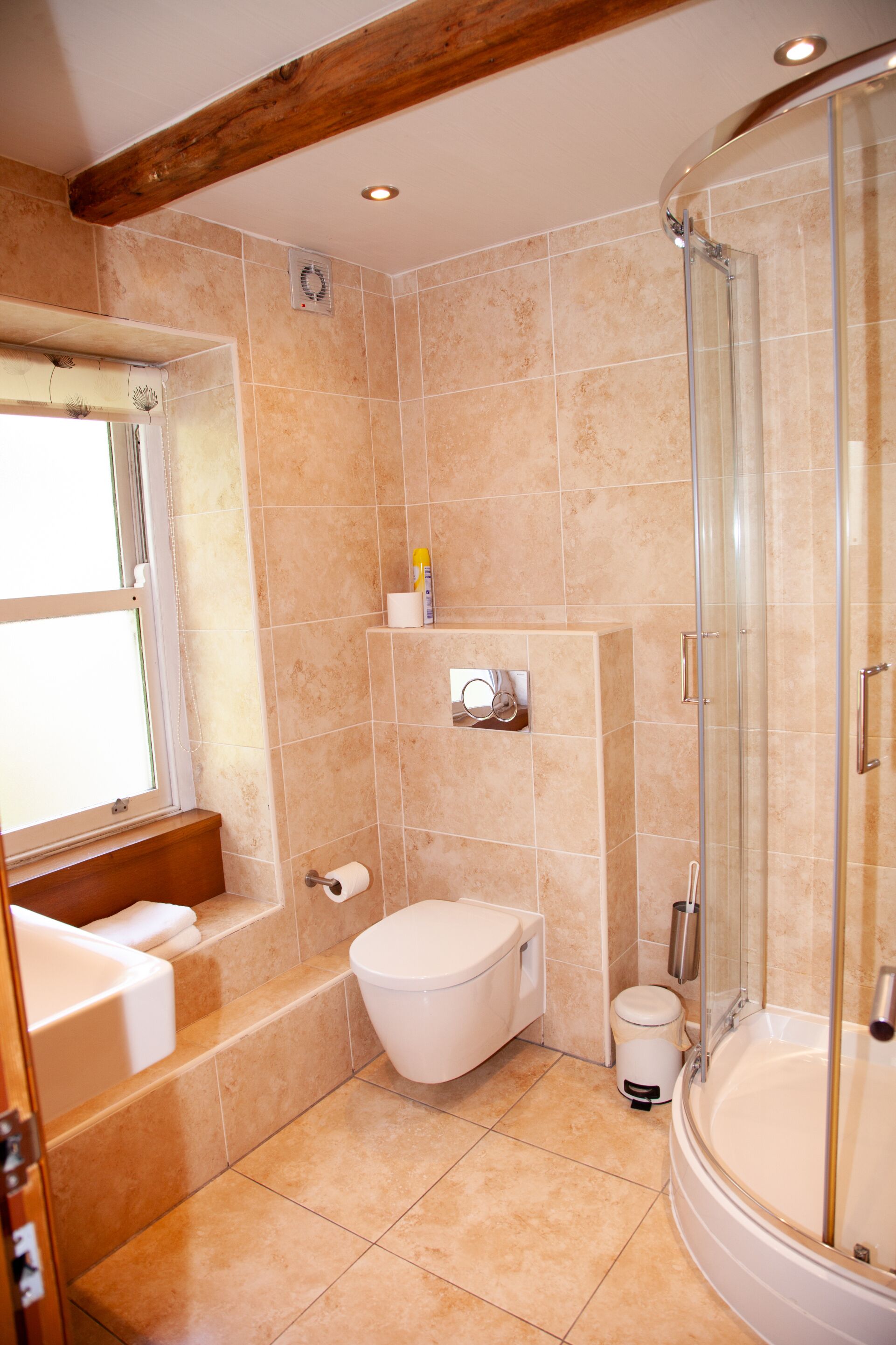 A bathroom with a bathtub, toilet, and shower.