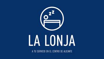 A logo with a bed and a sleeping face, and the text "LA LONJA A TU SERVICIO EN EL CENTRO DE ALICANTE".
