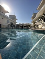 Outdoor pool, open 8:00 AM to 8:00 PM, sun loungers