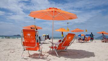On the beach, sun loungers, beach umbrellas, beach towels